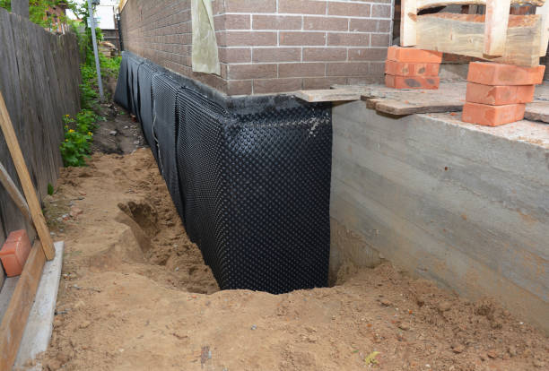 Happy homeowners after waterproofing job in Patricksburg